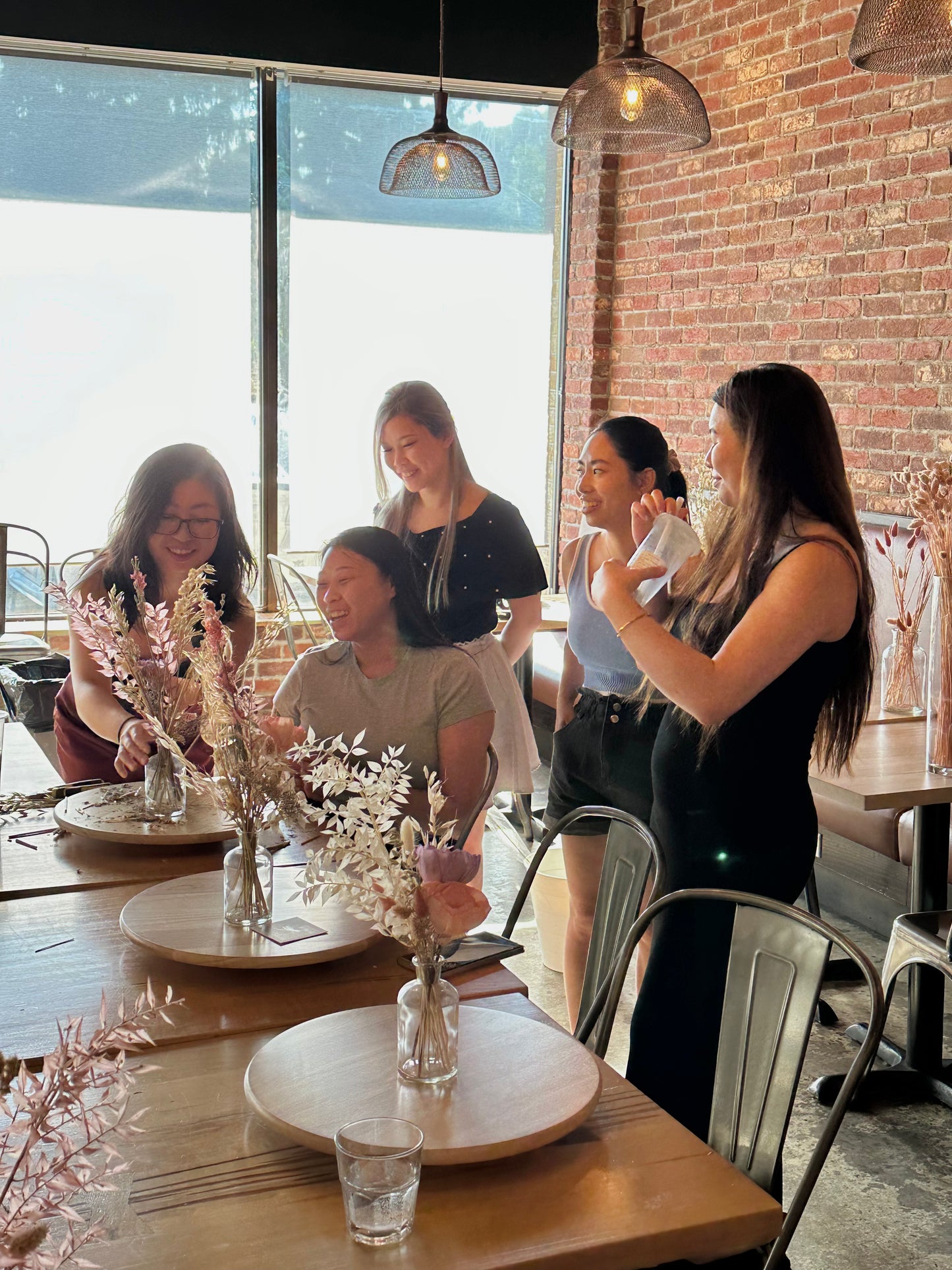 Participants creating dried flower arrangements during the Markham workshop