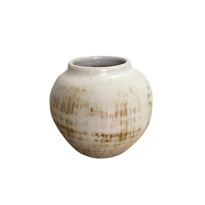 Round ceramic vase with a textured surface on a white background