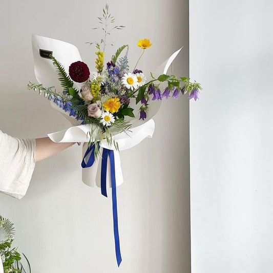 bouquet of blue purple yellow flowers