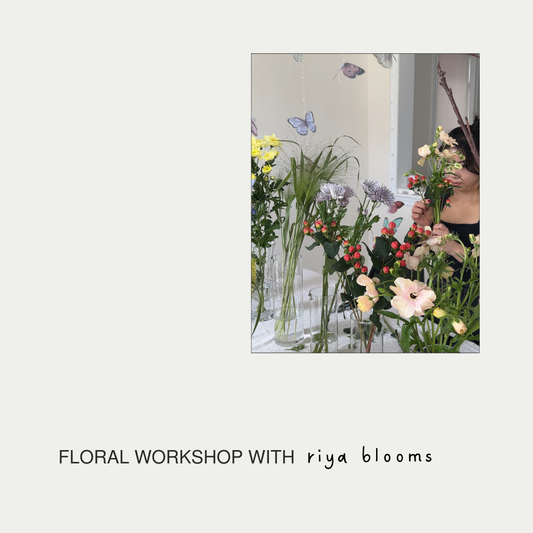 Floral workshop with riya blooms featuring a person holding flowers and floral arrangements.